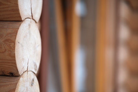 Natural background pattern of log wall. Construction of houses made of wood, rounded timber.の写真素材