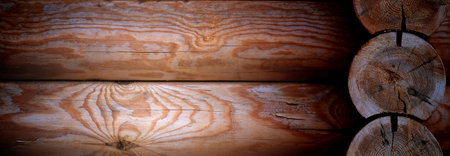 Natural background pattern of log wall. Construction of houses made of wood, rounded timber.の写真素材