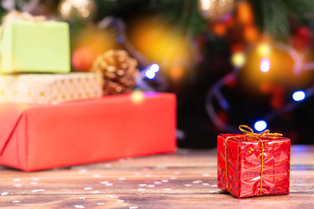 Christmas scene with tree gifts and fire in backgroundの写真素材