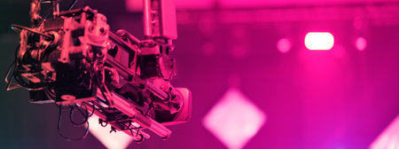 TV camera on a crane at a football match or concert. Close-up live video broadcast camera.の写真素材