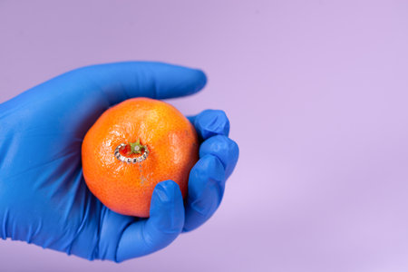 Tangerine with decorative jewelry. Minimal creative concept.の写真素材