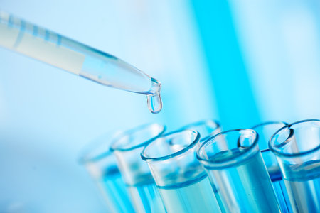 Chemical test tubes close-up with blue liquid. Medicine, pharmaceuticals, chemistryの写真素材