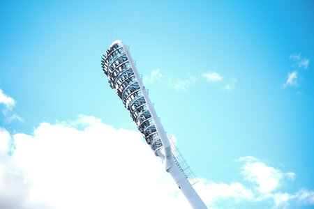 Stadium light with copy space. Stadium floodlights against a clear blue skyの写真素材