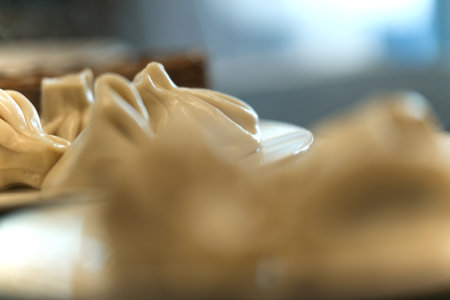 Fresh prepared Georgian dumplings of Khinkali are shown on a plate, close -upの写真素材