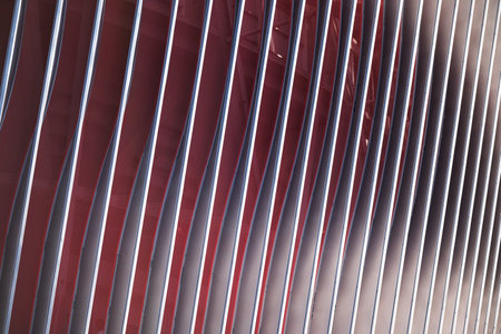 Cladding of a modern sports stadium against a blue skyの写真素材