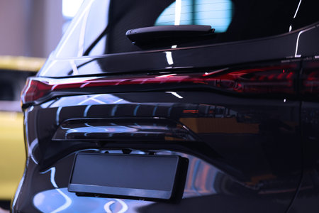 The body of a new car. Rear view. Car in the store showroom