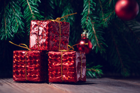 Red gifts under the Christmas treeの写真素材