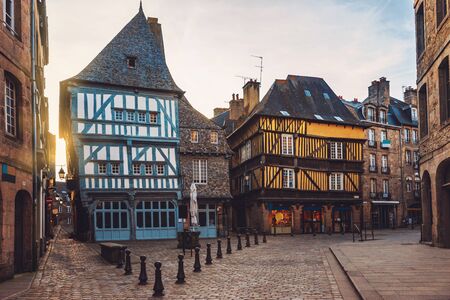 Beautiful street of the medieval French city of Dinan with ancient half-timbered houses. Popular tourist city of France. Dinan is a walled Breton town and  tourist attraction in Brittany, France.の写真素材