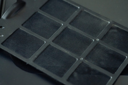 dirty dust filter.A layer of grey dust on the filter from the computer.dust cleaning in electronics...