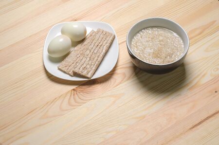 two boiled eggs porridge useful breakfastの写真素材