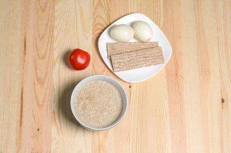 two boiled eggs porridge useful breakfastの写真素材