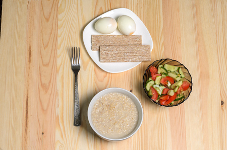 two boiled eggs porridge useful breakfastの写真素材