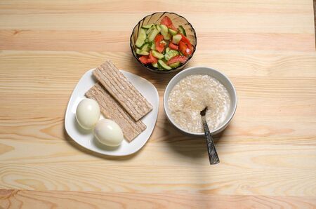two boiled eggs porridge useful breakfastの写真素材