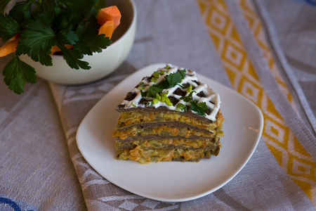 Pie beef liver with onions and tuschenym Markovka on a plate decorated with mayonnaise. Liver cake. Pork liver. Beef liver.の写真素材