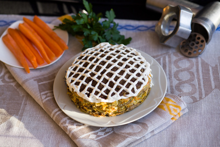 Pie beef liver with onions and tuschenym Markovka on a plate decorated with mayonnaise. Liver cake. Pork liver. Beef liver.の写真素材