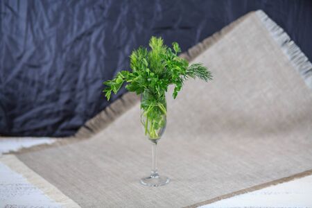 Fresh greens fennel parsley onions on a gray backgroundの写真素材