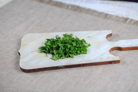 Fresh greens fennel parsley onions on a gray backgroundの写真素材