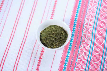 Dry seasoning fennel in a white plate on a light background