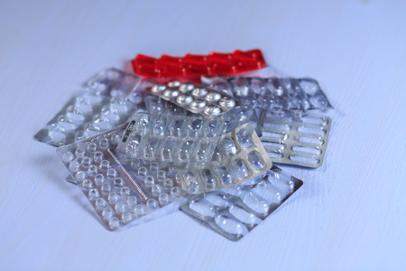 Medicines on a blue wooden backgroundの写真素材