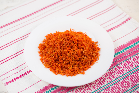 Vegetable orange boiled carrots on a table. Seasoning, spices.の写真素材