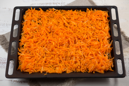 Vegetable orange boiled carrots on a table. Seasoning, spices.の写真素材