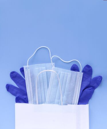 Coronavirus. Coronavirus infection. Two disposable medical masks and a pair of latex gloves. Medical protection of the face and hands.の写真素材