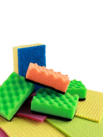 cleaning sponges of different bright colors for washing dishes and cleaning the room and disinfection on a white background, the concept of cleaning, surface disinfection. cleaning services. isolateの写真素材