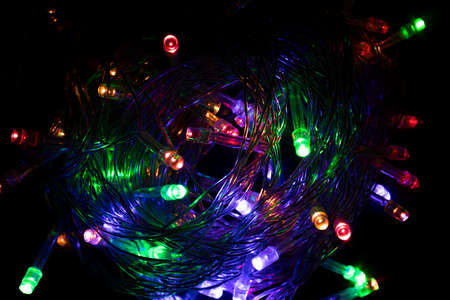bright Christmas lights on a dark background. Blur. defocused, New Year. Decor, Garland.の写真素材