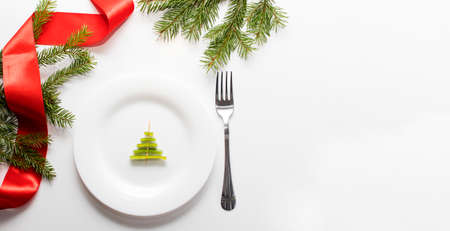 Christmas funny food, christmas tree on white plate. New Year food background top view. Holiday, celebration, food art concept. copy spaceの写真素材