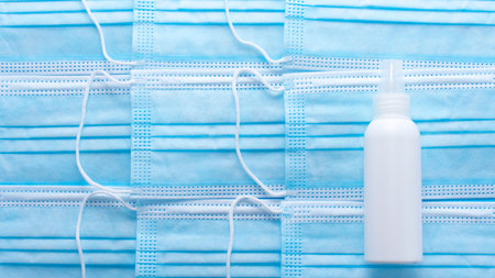 background of Medical hygienic masks, Face protective masks on blue background. Disposable surgical...