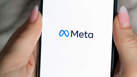 Smartphone with Meta logo in womens hands. The concept of using social networks. March 13, 2022 - Mogilev. Belarusのeditorial素材
