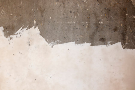 The concrete wall is partially putty. concrete background, plaster background, building backgroundの写真素材