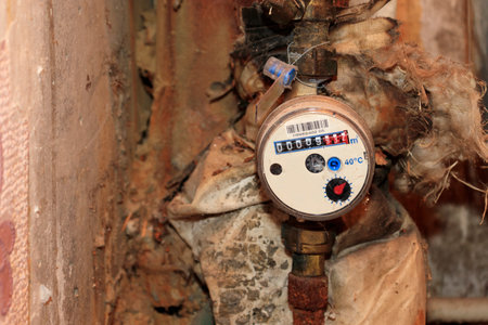 water counter. A device for metering cold or hot water on a rusty old pipe.の写真素材