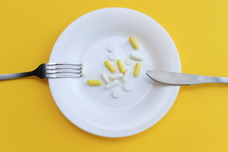 Health supplements, vitamin D, zinc and vitamin C and other vitamins on the plate. view from above. the concept of a healthy lifestyle, Beauty Supplements, Multivitamin Tabletの写真素材