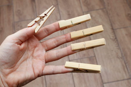 Clothespins for linen on womens fingers