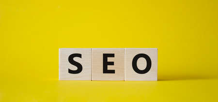 CEO symbol. Concept word CEO on wooden cubes. Beautiful yellow background. Business and CEO concept. Copy space.の写真素材