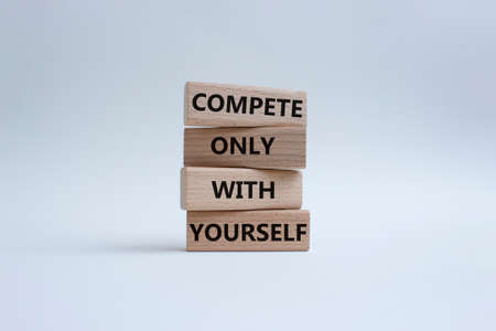 Compete only with yourself symbol. Concept words compete only with yourself on wooden blocks. Beautiful white background. Business and Compete only with yourself concept. Copy space.の写真素材