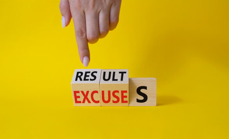 Results Excuses symbol. Businessman Hand points at wooden cubes with words Excuses and Results. beautiful yellow background. Business and Results Excuses concept. copy spaceの写真素材