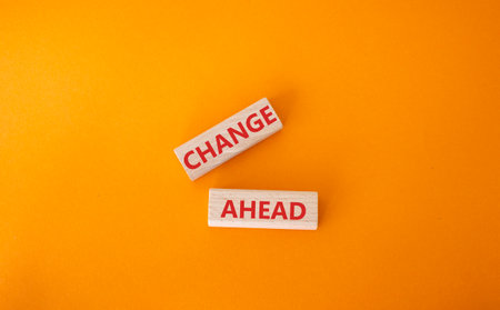 Change ahead symbol. Wooden blocks with words Change ahead. Beautiful orange background. Business and Change ahead concept. copyspace.の写真素材