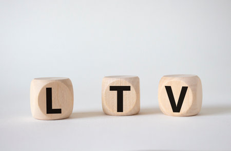 LTV - Life Time Value symbol. Concept word LTV on wooden cubes. Beautiful white background. Business and LTV concept. copyspace.の写真素材
