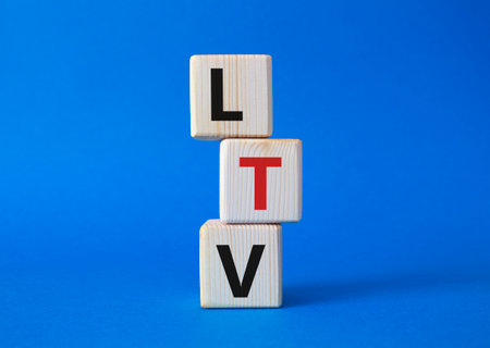 LTV - Life Time Value symbol. Concept word LTV on wooden cubes. beautiful blue background. Business and LTV concept. copyspace.の写真素材