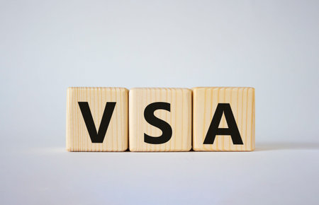 VSA - Volume Spread Analysis symbol. Wooden cubes with word VSA. Beautiful white background....