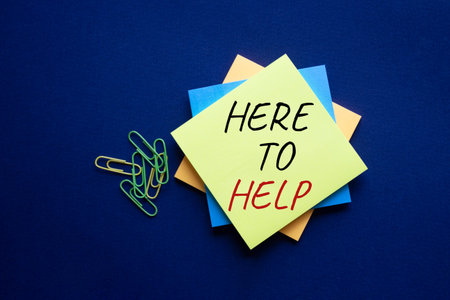 Here to help symbol. Yellow steaky note with words Here to help. Beautiful deep blue background....