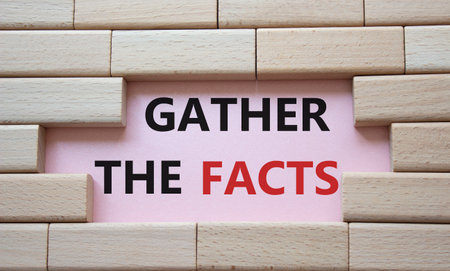 Gather the facts symbol. Wooden blocks with words Gather the facts. Beautiful pink background. Business and Gather the facts concept. copyspace.の写真素材
