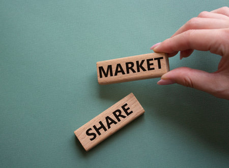 Market share symbol. Wooden blocks with words Market Sharer. Beautiful gray green background. businessman hand. Business and Market Share concept. copyspace.の写真素材