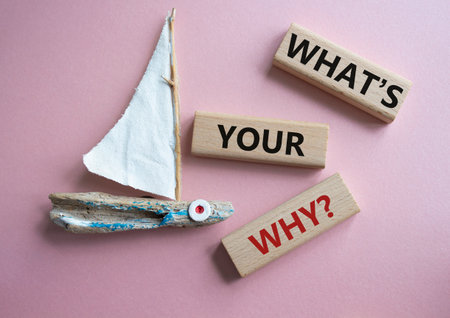 What is Your Why symbol. Concept words What is Your Why on wooden blocks. Beautiful pink background with boat. Business and What is Your Why concept. copyspace.の写真素材
