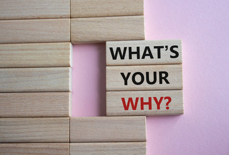 What is Your Why symbol. Concept words What is Your Why on wooden blocks. beautiful pink background. Business and What is Your Why concept. copyspace.の写真素材