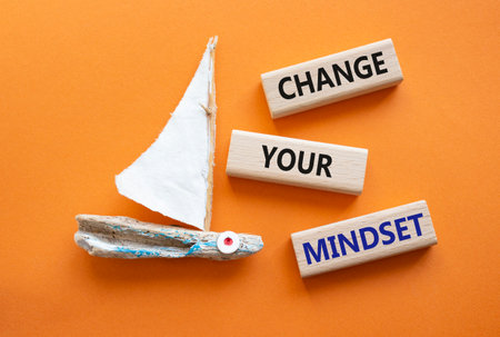 Change your mindset symbol. Concept words Change your mindset on wooden blocks. Beautiful orange background with boat. Business and Change your mindset concept. Copy space.の写真素材