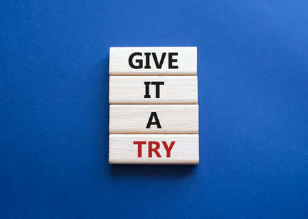 Give it a try symbol. Concept words Give it a try on wooden blocks. Beautiful deep blue background. Business and Give it a try concept. Copy space.の写真素材