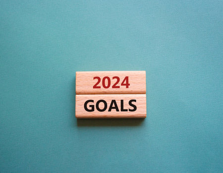2024 Goals symbol. Wooden blocks with words 2024 Goals. Beautiful gray green background. Business...